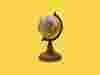 A globe on a yellow background