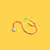 A pink stethoscope on a yellow background