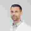 Sirio Dupont wearing lab coat
